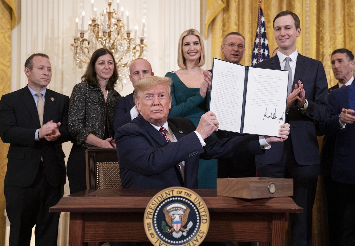 President Trump displays the controversial Executive Order on Combating Anti-Semitism during an afternoon Hanukkah reception alongside members of his administration, including son-in-law Jared Kushner, in the White House, December 11, 2019. (Joyce N. Boghosian/White House Photo)