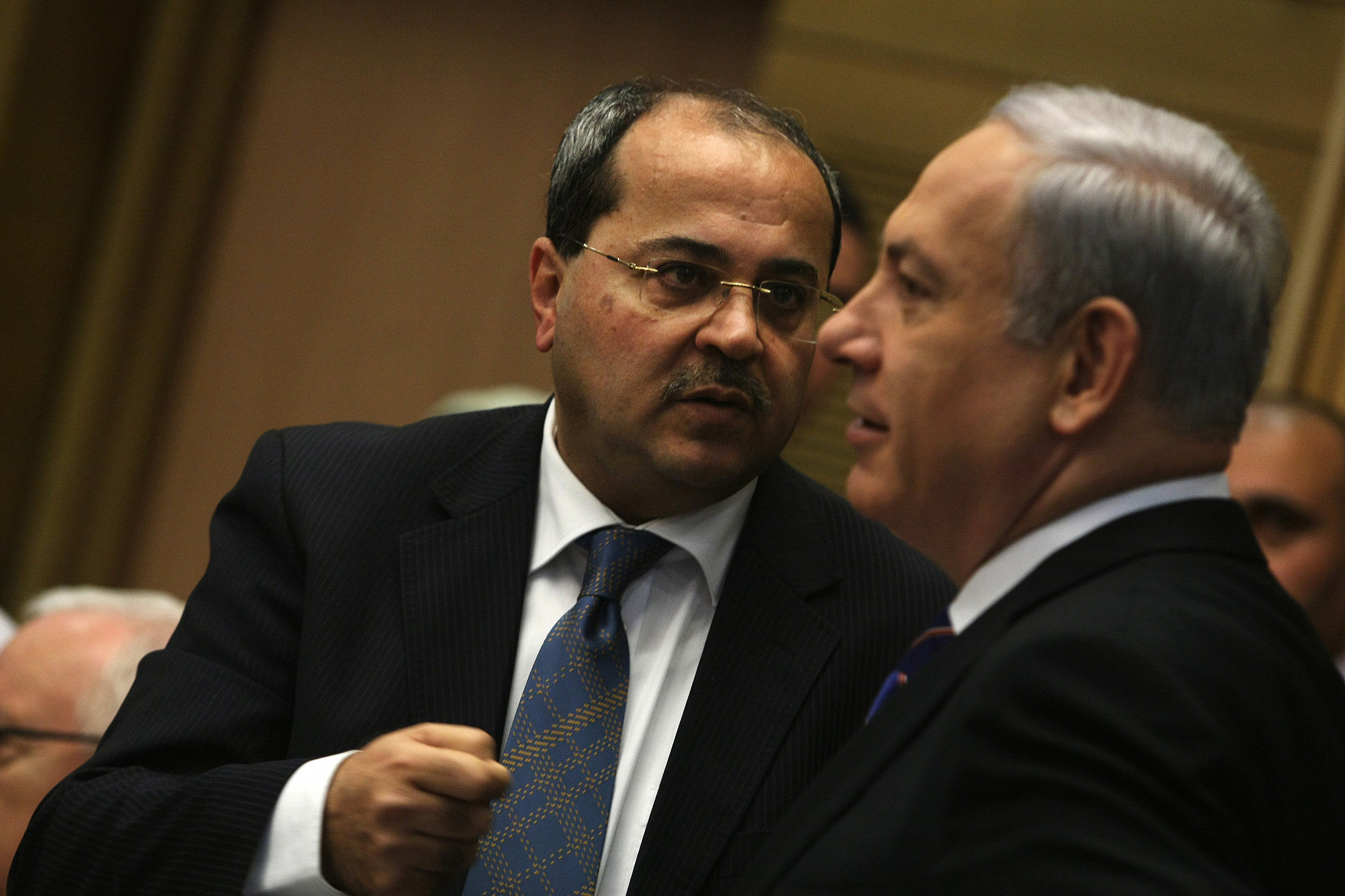 MK Ahmad Tibi speaks with Prime Minister Benjamin Netanyahu during a session of a parliamentary committee of inquiry devoted to the problem of rampant violence in the Palestinian community in Israel at the Knesset in Jerusalem, February 13, 2012. (Kobi Gideon/Flash90)