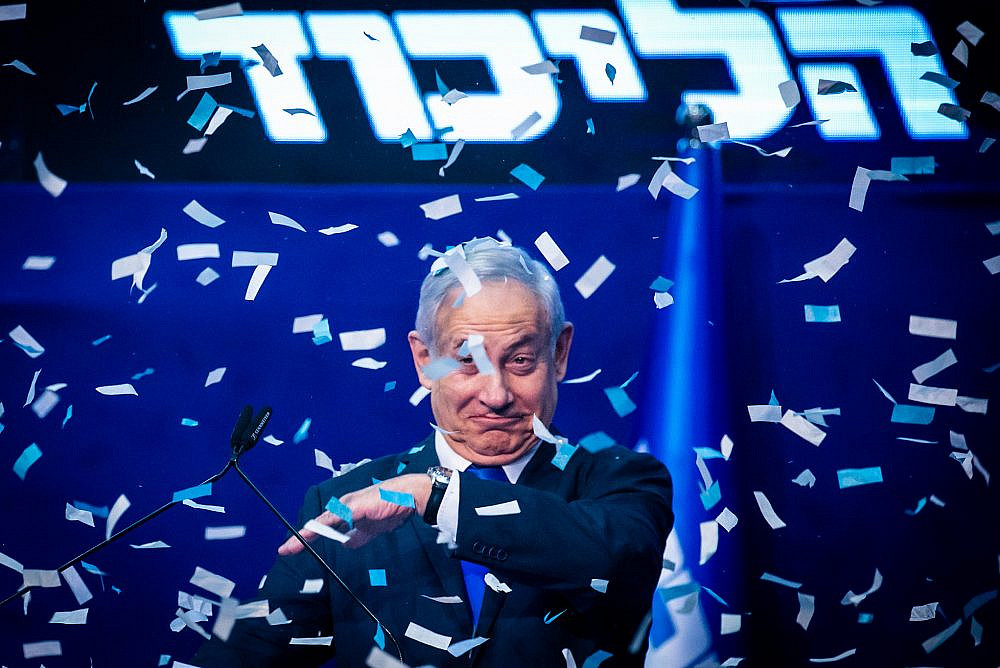 Prime Minister Benjamin Netanyahu and his wife Sara address their supporters on the night of the Israeli elections, at the party headquarters in Tel Aviv, March 3, 2020. (Olivier Fitoussi/Flash90)