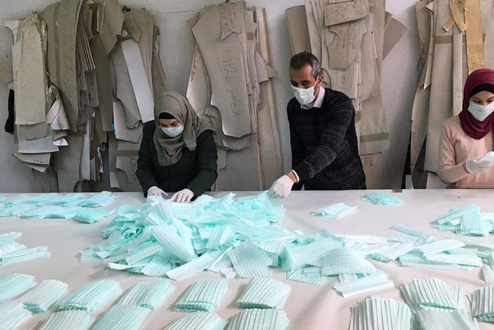 Amjad Zaghir, the only mask manufacturer in the West Bank, at his Hebron factory. (Courtesy of Amjad Zaghir)