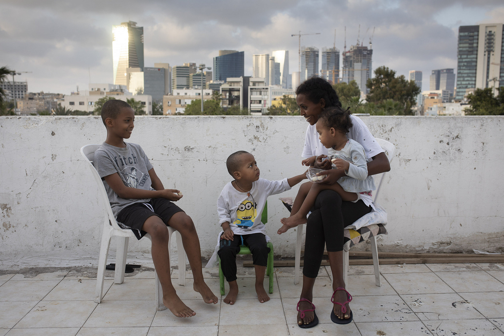 Niatt (29), a single mother, and her children Yafa (9), Osher (4) and Morel (2). They have been in the country for 13 years. The family lives in a two-room apartment in south Tel Aviv. Before the crisis started, Niatt was supposed to start working in a clothing store, but the store closed and she was left without work.