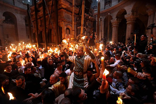 Orthodox Christian worshippers take part in the Holy Fire ceremony at the Church of the Holy Sepulchre in Jerusalem's Old City during the Easter holiday, April 23, 2011. (Kobi Gideon /Flash90)
