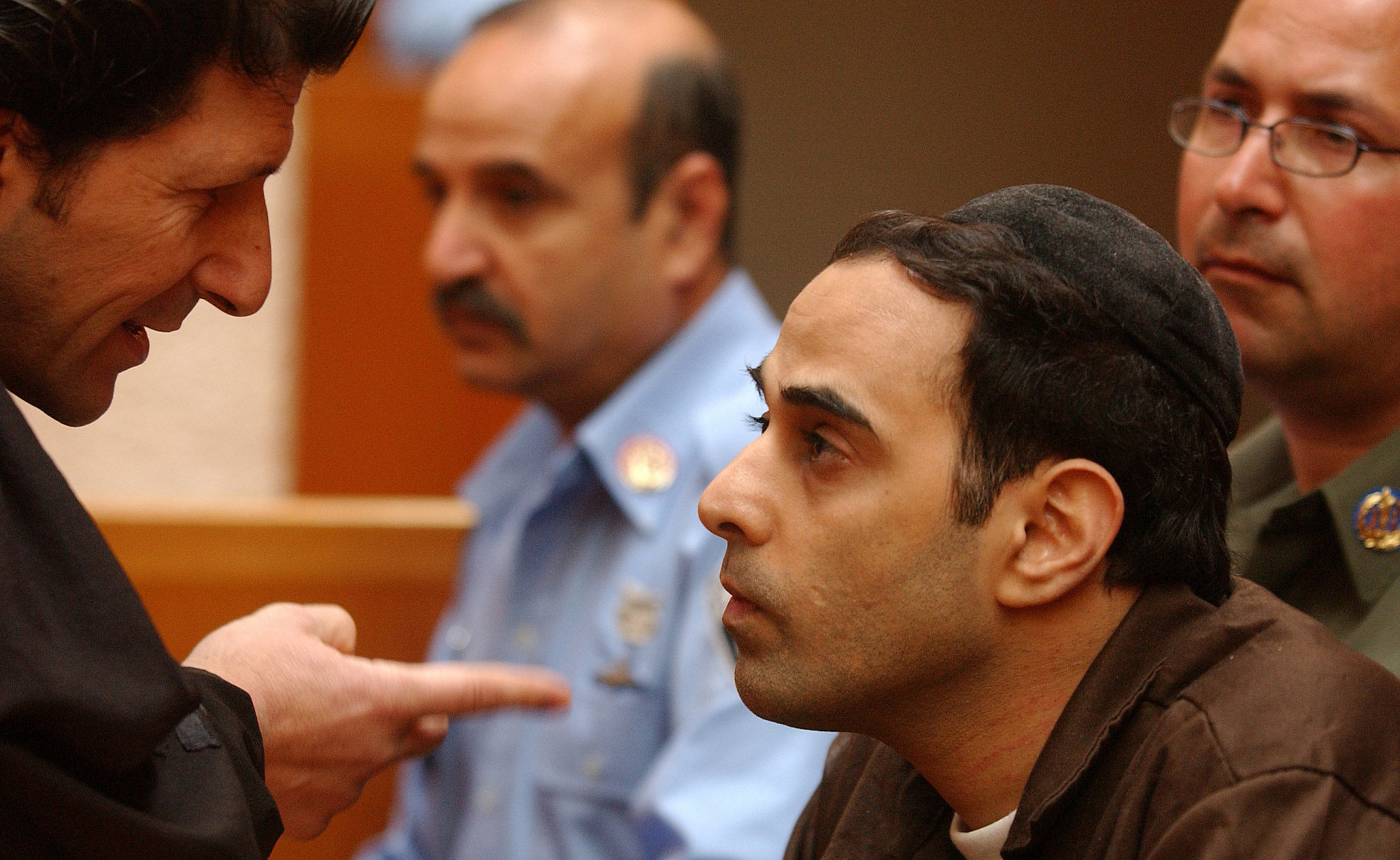 Yigal Amir, who was charged with the murder of Israeli Prime Minister Yitzhak Rabin, speaks with his lawyer Shmuel Casper at the Supreme Court in Jerusalem on March 07, 2005. (Flash90)