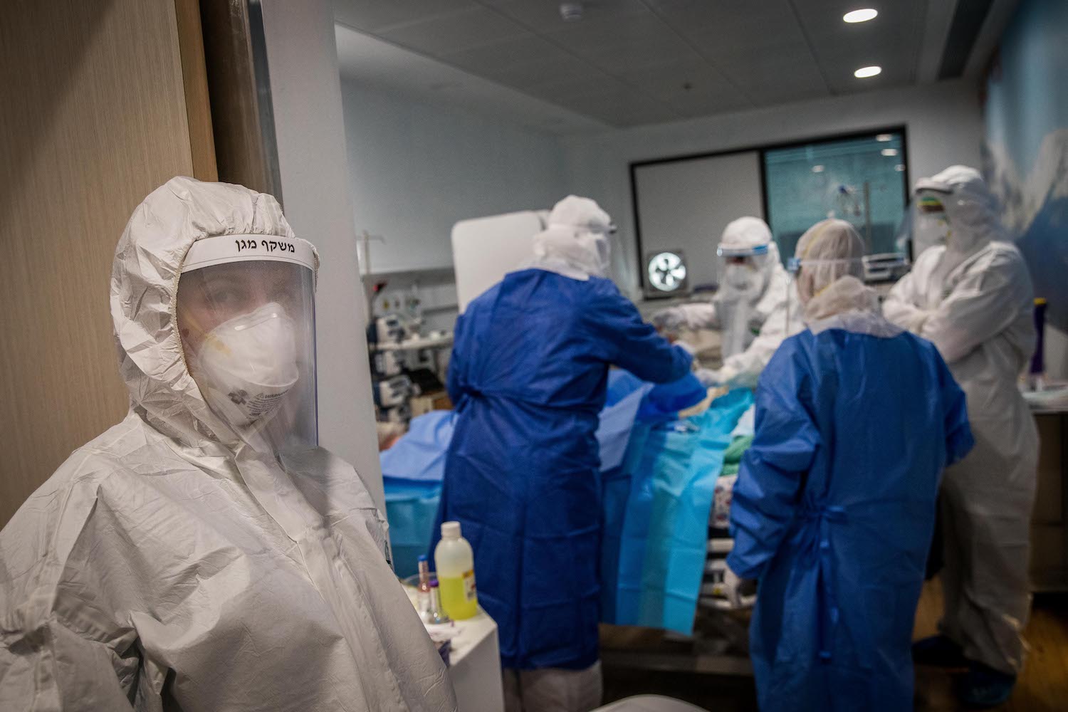 A medical team seen treating a coronavirus patient at Mayanei Hayeshua Medical Center, Bnei Brak, Israel, April 13, 2020. (Nati Shohat/Flash90)