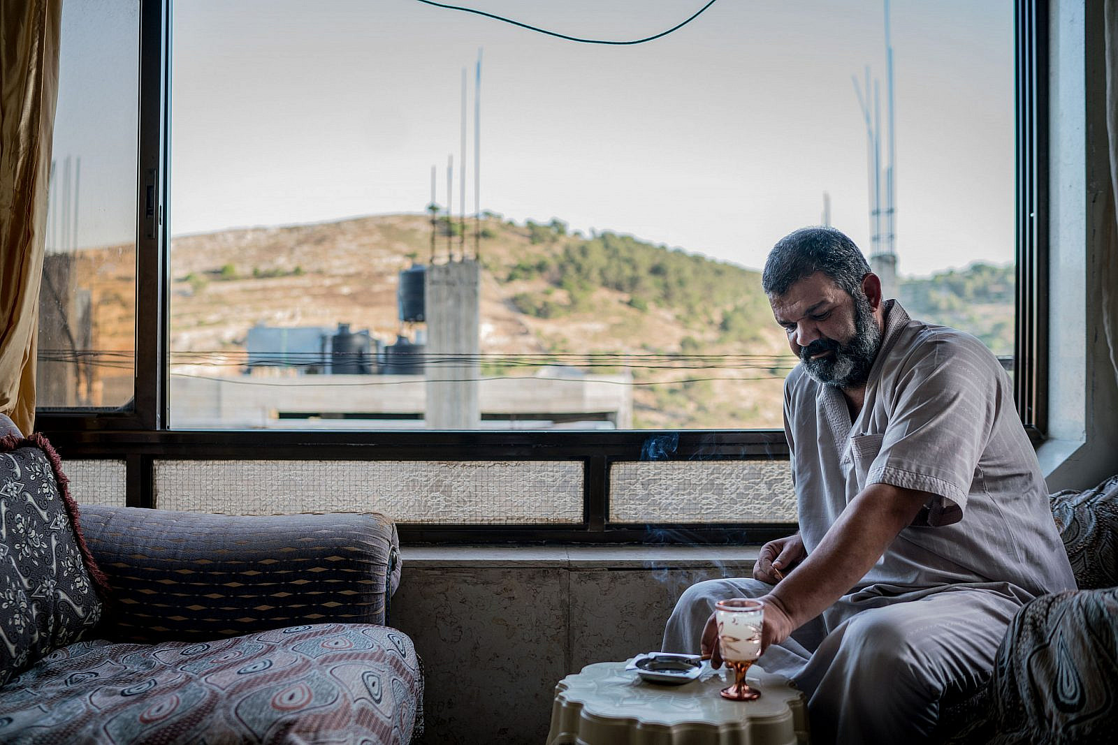 Awad Abu Swai in his home in Artas near Bethlehem in the occupied West Bank. June, 2020. (Samar Hazboun)