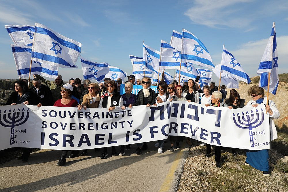 Likud supporters march alongside Israeli Minister of Diaspora Affairs Tzipi Hotovely in the Gush Etzion settlement in the occupied West Bank to demand Israel annex the West Bank, February 27, 2020. (Gershon Elinson/ Flash90)