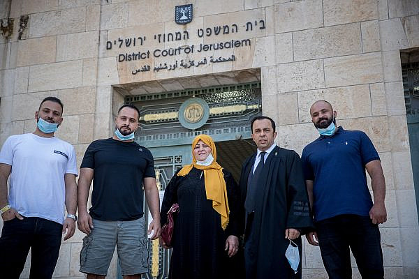 Amal Sumarin, her sons, and their attorney arrive for a court hearing on the JNF-KKL appeal to evict them from their family home at the Jerusalem District Court on June 30, 2020. (Yonatan Sindel/Flash90)