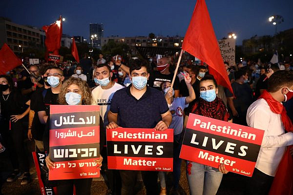 Thousands of Israeli and Palestinian protesters take part in a demonstration in Rabin Square against the government's annexation plan, Tel Aviv, June 6, 2020. (Oren Ziv)