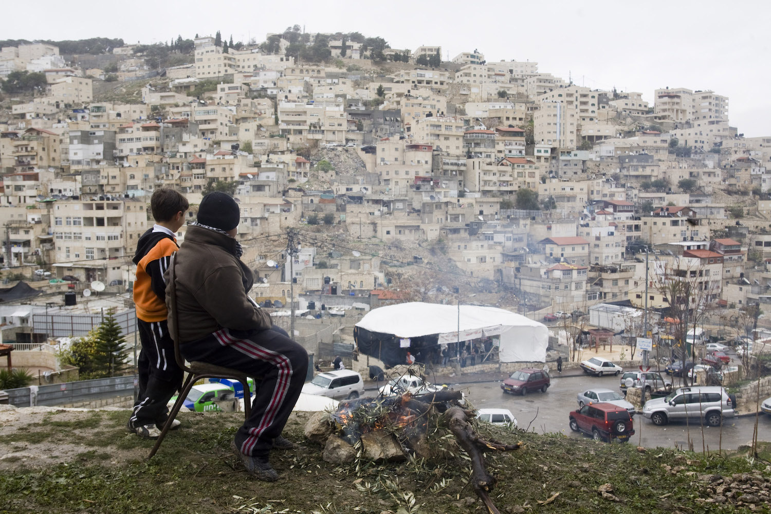 Palestinians look over a protest tent against evictions and home demolitions in the East Jerusalem neighborhood of Silwan, February 27, 2009. (Oren Ziv/Activestills.org)