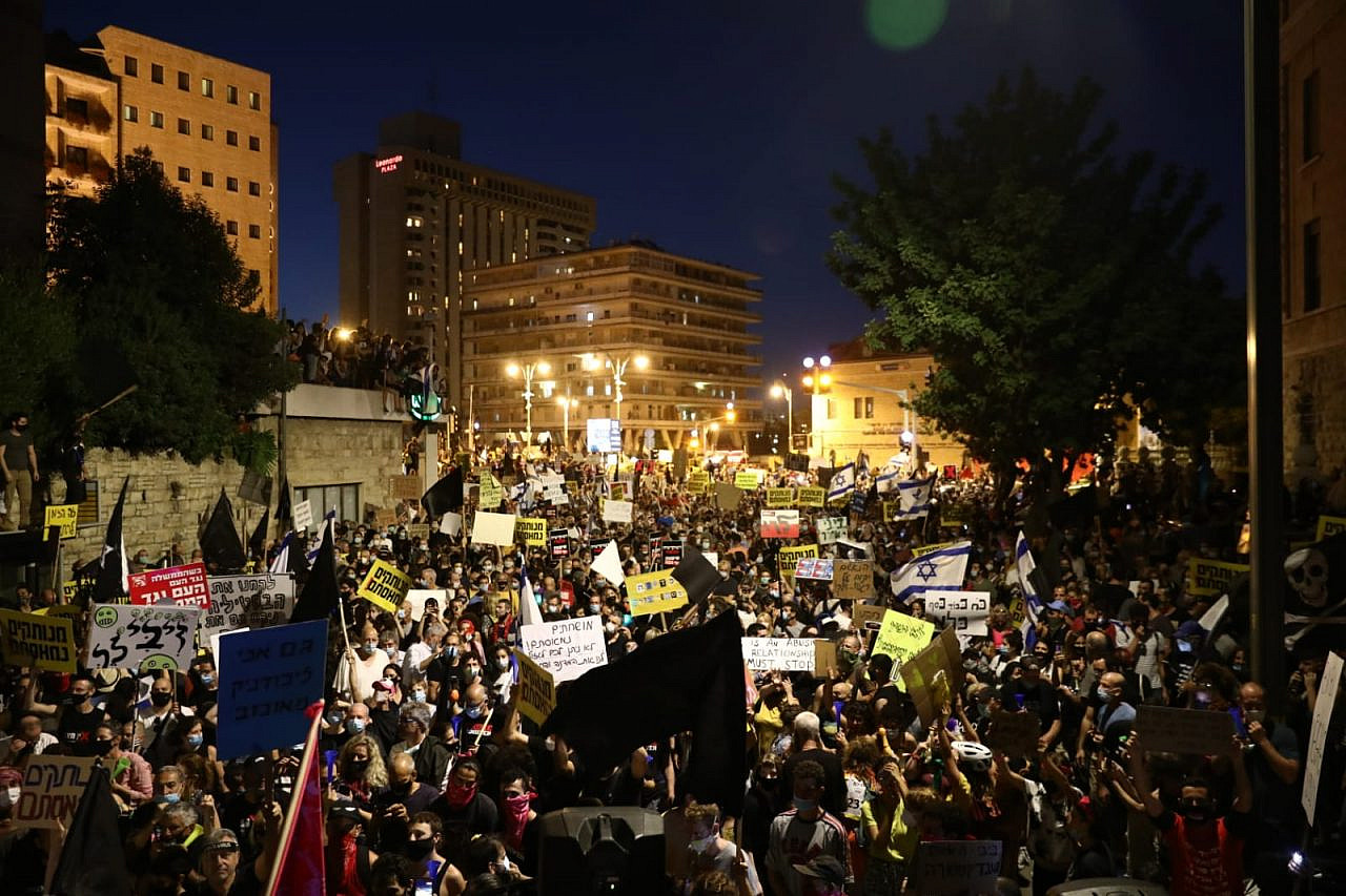 Thousands take part in a mass demonstration outside the Prime Minister's Residence in Jerusalem, demanding Benjamin Netanyahu step down over his corruption scandals, July 14, 2020. (Oren Ziv)