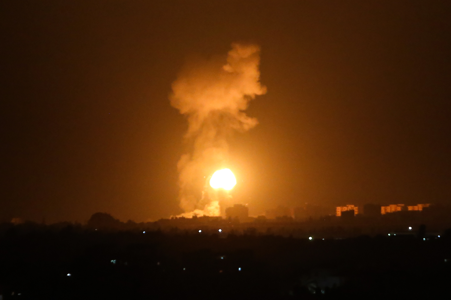 A ball of fire and smoke rises during Israeli airstrikes in Khan Younis in the southern Gaza Strip, August 16, 2020. (Abed Rahim Khatib/Flash90)