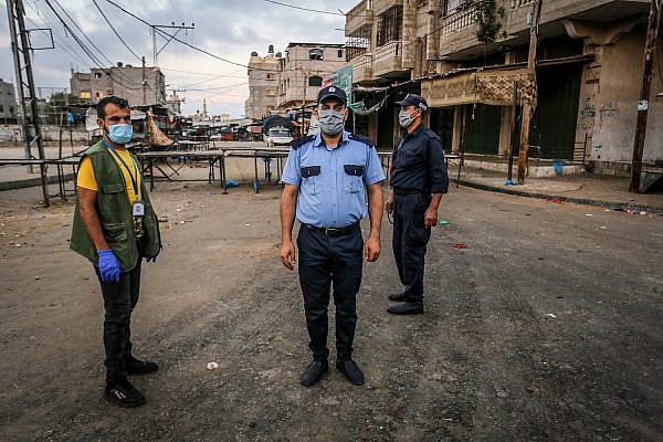 Members of the Palestinian security forces enforce a full lockdown for 48 hours following the spread the of the coronavirus, Rafah, southern Gaza Strip, August 25, 2020. (Abed Rahim Khatib/Flash90)