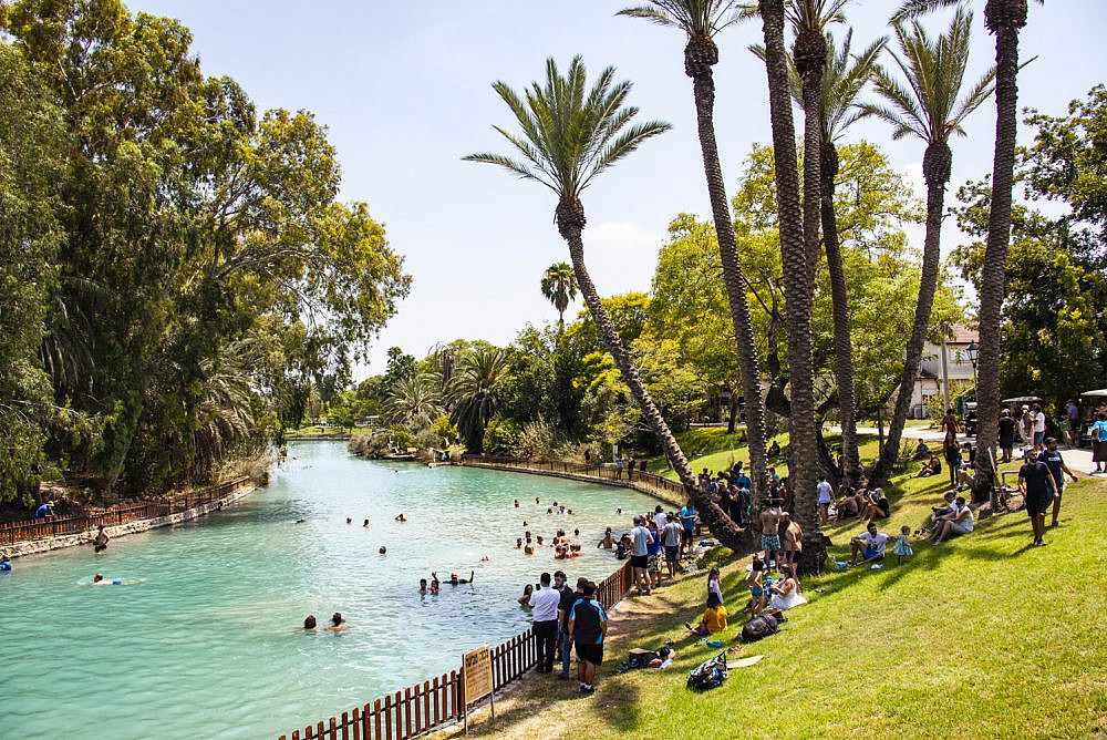 Israeli activists and supporters enter Kibbutz Nir David and swim in the Asi River for a couple of hours on August 14, 2020. (Photo by Mati Milstein)