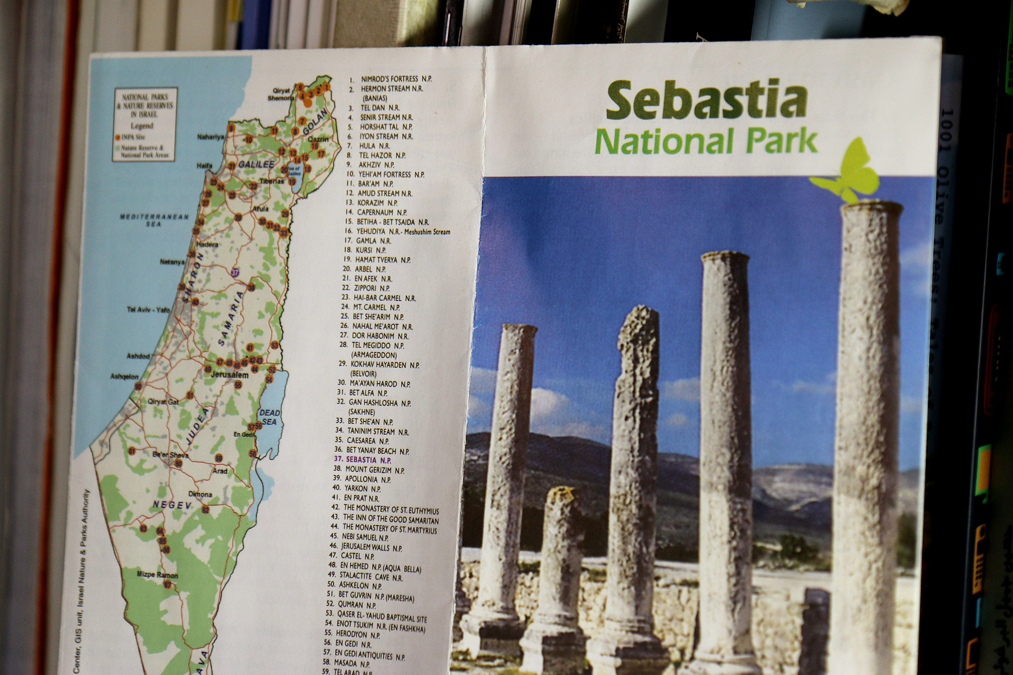 A copy of an Israeli Nature and Parks Authority brochure presenting Sebastia as an Israeli tourist site, July 5, 2015. (Ahmad al-Bazz/Activestills)