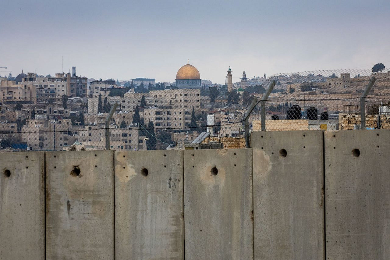 View of the separation wall and Al-Aqsa compound in the background on February 2, 2020. (Olivier Fitoussi/Flash90)