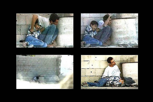 Footage taken by Talal Abu Rahma shows Jamal al-Durrah trying to protect his son, Muhammad, on September 30, 2000. (France 2/Wikimedia)