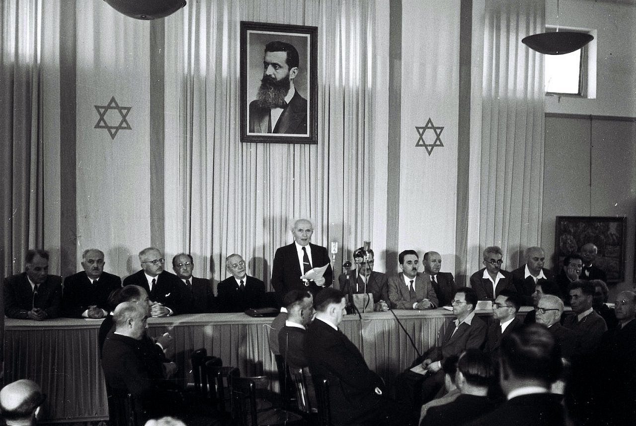 David Ben Gurion, who was to become Israel's first prime minister, reads the Declaration of Independence on May 14, 1948 at the museum in Tel Aviv, during the ceremony founding the State of Israel. (Zoltan Kluger/GPO)