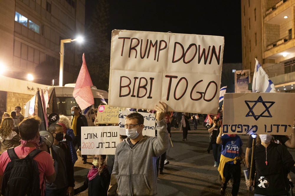 Protesters celebrate Joe Biden's election victory during the weekly demonstration against Prime Minister Netanyahu, Jerusalem, November 7, 2020. (Oren Ziv)