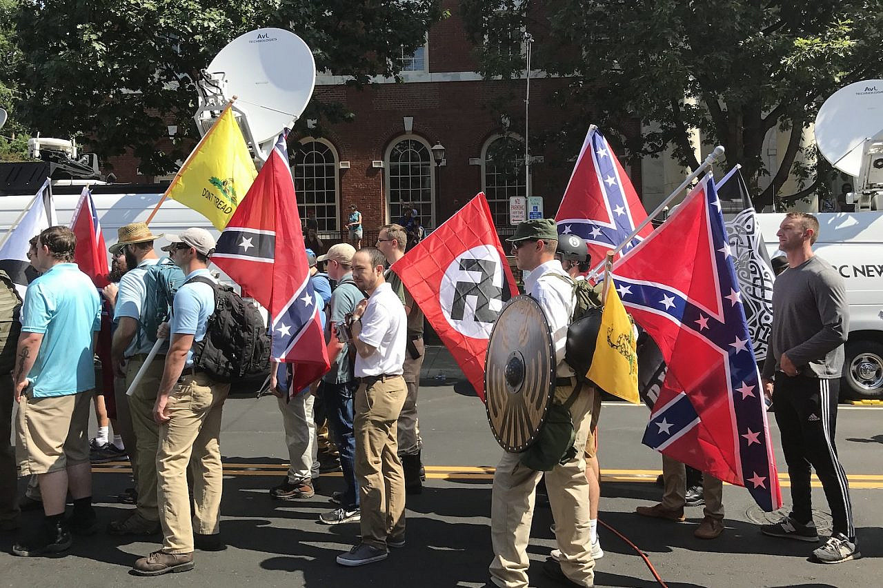 Alt-right members preparing to enter Emancipation Park holding Nazi and Confederate flags before the 'Unite the Right' rally, Charlottesville, Virginia, August 12, 2017. (Anthony Crider/CC BY 2.0)