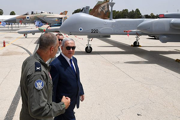 Prime Minister Benjamin Netanyahu meets with Base Commander Brigadier General Peleg Niago, during a visit to the Air Force base in Tel Nof to meet with foreign air force commanders, May 23, 2018. (Kobi Gideon/GPO)
