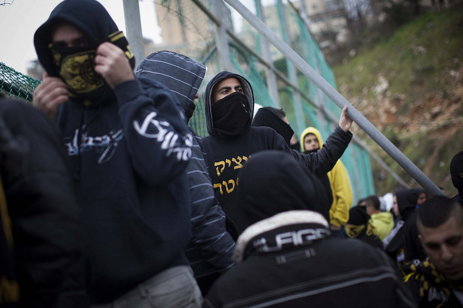Fans of Beitar Jerusalem soccer club protest the decision to sign two Chechen Muslims players Zaur Sadayev and Gabriel Kadiev, during a training in Jerusalem on Feb. 1, 2013. (Yonatan Sindel/Flash90)