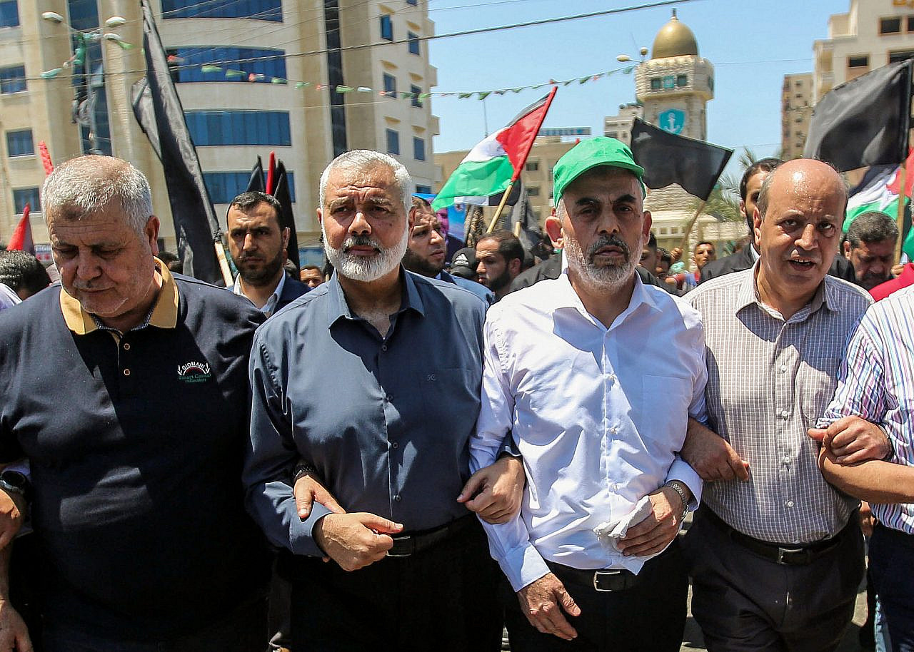 Hamas leaders in the Gaza Strip Ismail Haniyeh and Yahya Sinwar march during a protest against US President Donald Trump's “Deal of the Century” and the “Peace to Prosperity” conference in Bahrain, in Gaza City, June 26, 2019. (Hassan Jedi/Flash90)