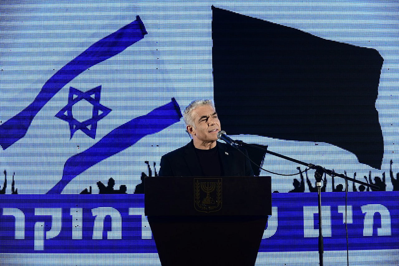 MK Yair Lapid speaks during a protest against Prime Minister Benjamin Netanyahu calling on him to quit, at Rabin Square in Tel Aviv on April 19, 2020. (Tomer Neuberg/Flash90)