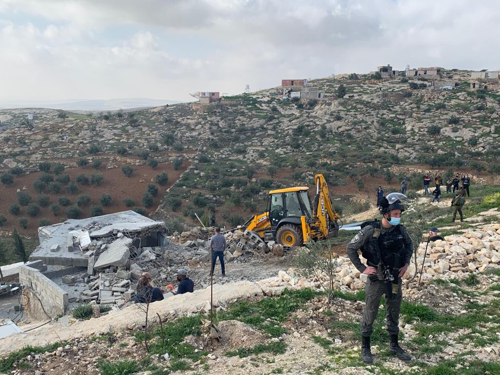 Israeli forces demolishing structures in the hamlet of Khalet al-Daba, in the occupied West Bank, March 2, 2021. (Basil al-Adraa)