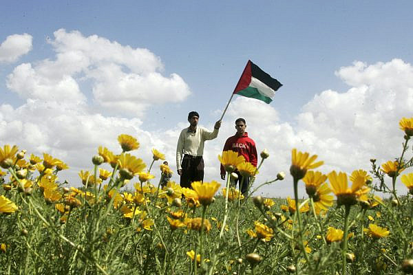Palestinian youth protest near the Israeli fence with Gaza, southern Gaza, March 18, 2010. (Abed Rahim Khatib/Flash 90)