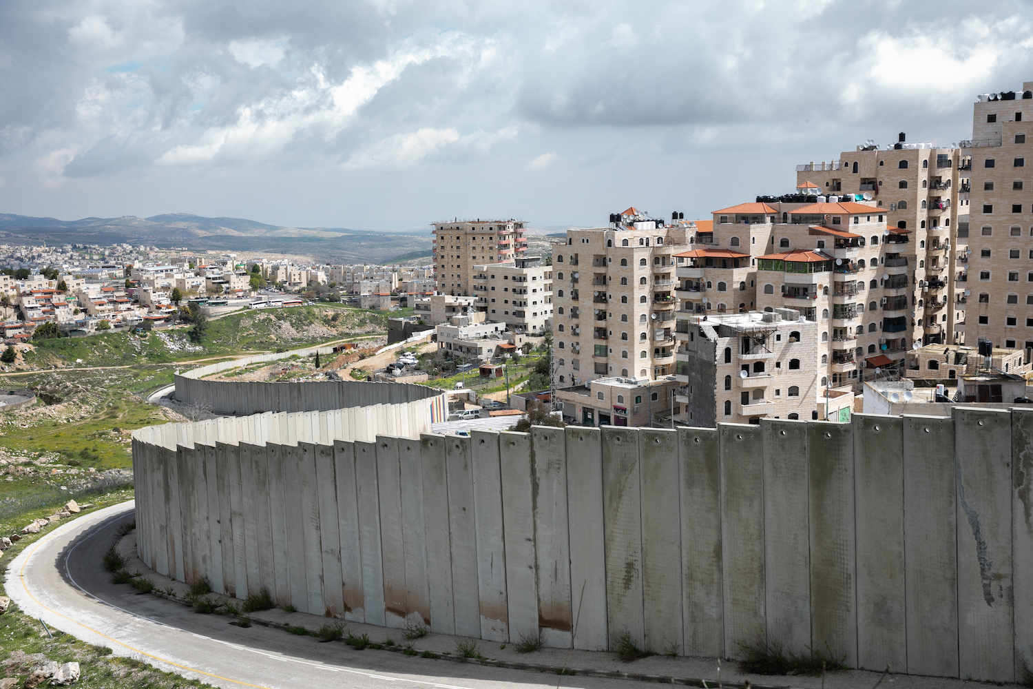 View of the separation wall and the Shuafat Refugee Camp northeast of Jerusalem, on March 22, 2020. (Olivier Fitoussi/Flash90)