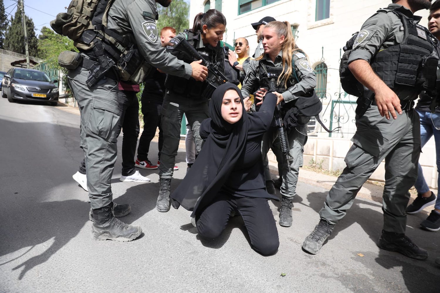 Israeli police detain a Palestinian woman in Sheikh Jarrah, May 10, 2021. (Oren Ziv)