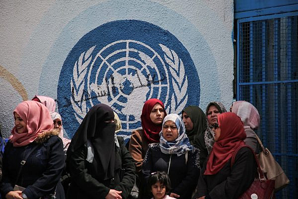 UNRWA staff members protest against budget cuts outside the UNRWA offices in Gaza City, April 14, 2019. (Hassan Jedi/Flash90)