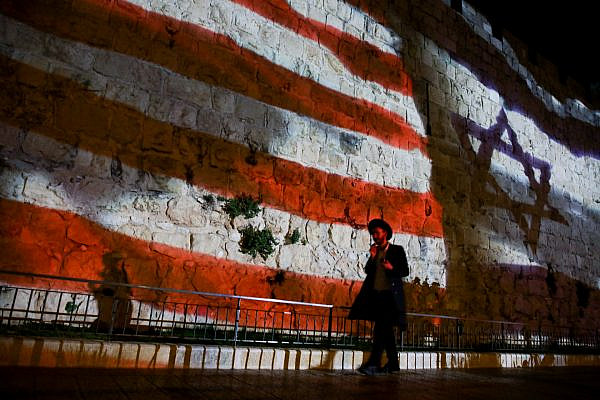 The Israeli and American flags screened on the walls of Jerusalem's Old City to mark one year since the transfer of the US Embassy from Tel Aviv to Jerusalem, May 14, 2019. (Aharon Krohn/Flash90)