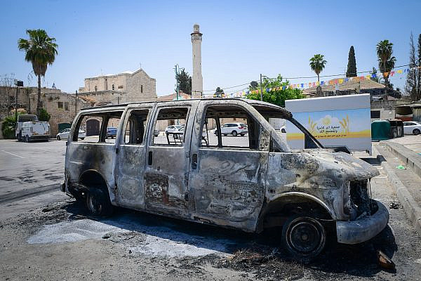 Torched synagogues and cars and vandalized stores in the central city of Lod, following a night of riots in the city, May 12, 2021. (Avshalom Sassoni/Flash90)