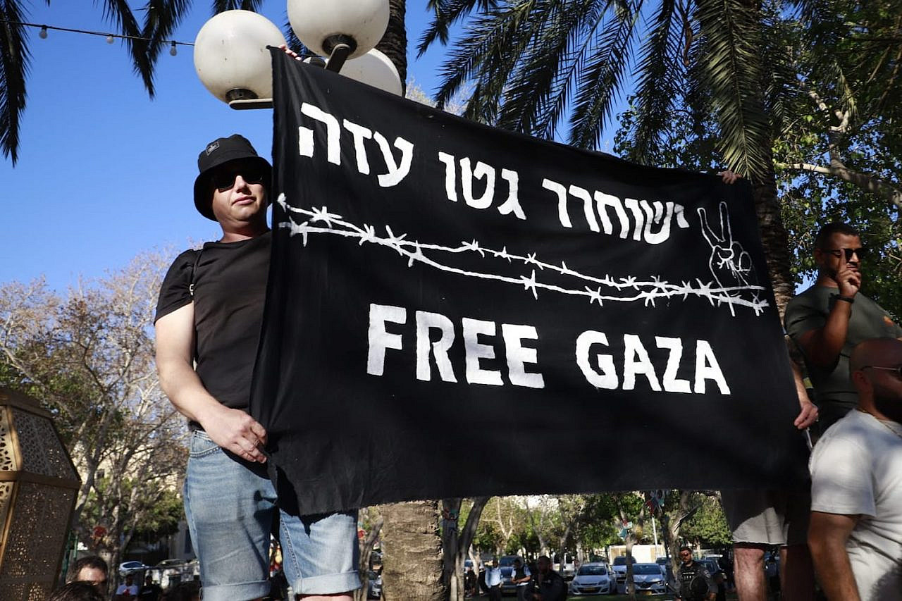 Israeli left-wing activists demonstrate in solidarity with Palestinians in Jaffa during the cross-country general strike to protest the war on Gaza and the upcoming eviction of several families from their homes in East Jerusalem, May 18, 2021. (Oren Ziv)