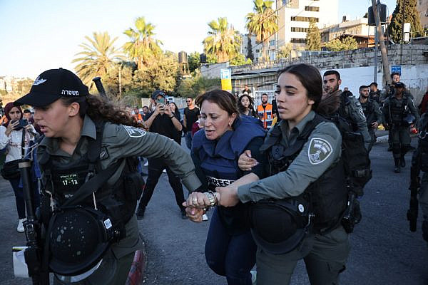 Israeli officers arrest Al Jazeera reporter Givara Budeiri in the East Jerusalem neighborhood of Sheikh Jarrah, June 6, 2021. (Oren Ziv)