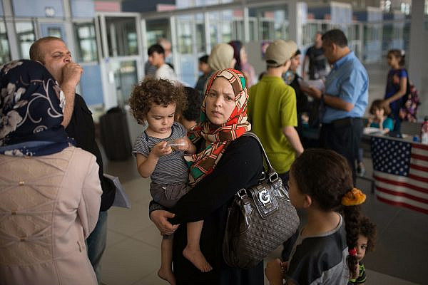 Palestinians wait at the Erez Crossing between Gaza and Israel on July 13, 2014. (Flash90)
