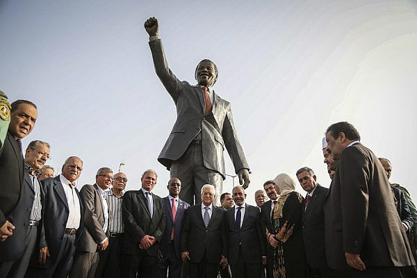 Palestinian President Mahmoud Abbas stands with Mpho Franklyn Parks Tau, Mayor of the city of Johannesburg, in front of the new Mandela statue during the inauguration of Nelson Mandela Square in the West Bank city of Ramallah, April 26, 2016. (Flash90)