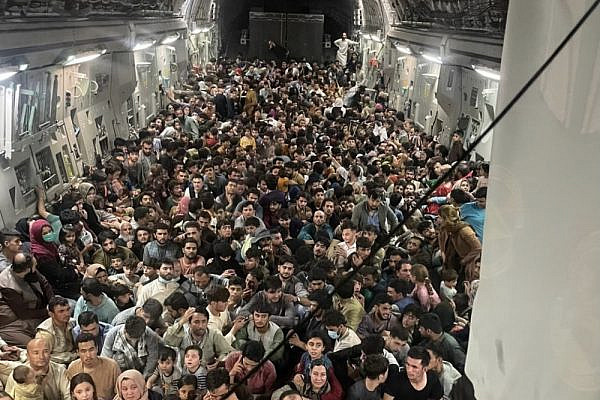 A U.S. Air Force plane transports hundreds of Afghan citizens from Hamid Karzai International Airport following the Taliban's takeover of the city, August 15, 2021. (Courtesy of the U.S. Air Force)