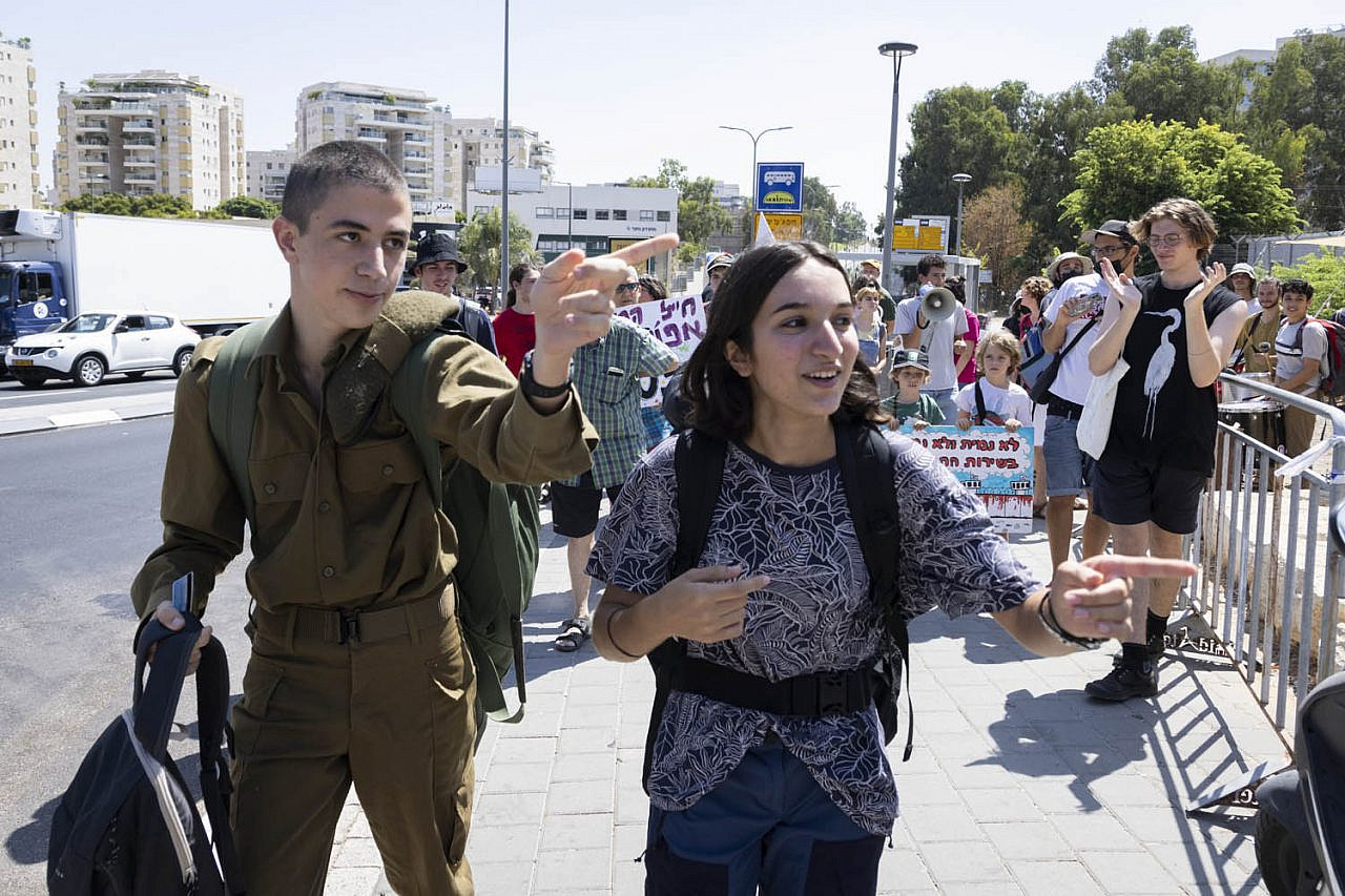 Conscientious objectors Eran Aviv (left) and Shahar Perets seen outside the IDF induction center, Tel Hashomer, central Israel, August 31, 2021. (Oren Ziv)