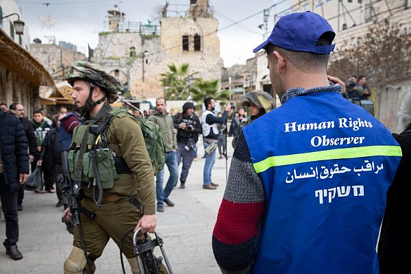 A member of the Temporary International Presence in Hebron (TIPH), a civilian observer mission in Hebron, seen in the West Bank city on January 28, 2019. That year, the Israeli government refused to renew TIPH's mandate, effectively removed the force from the city. (Catherine Curran-Groome)