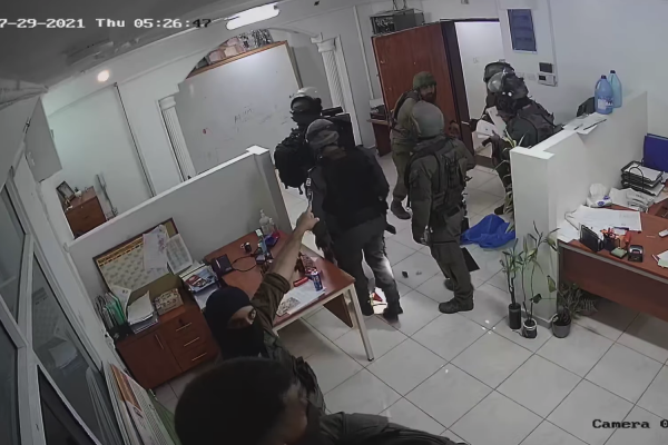 Israeli soldiers confiscate computer equipment and client files in a raid on the offices of Defense for Children International - Palestine, Al-Bireh, West Bank, July 29, 2021. (DCI-P)