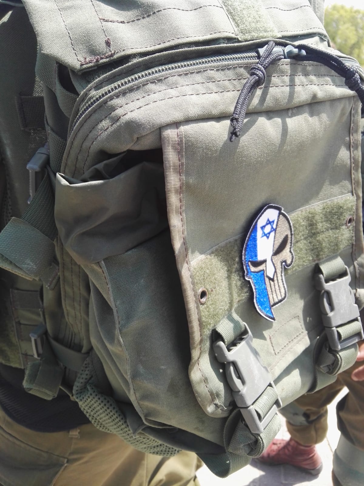 An Israeli soldier carrying a backpack with the Punisher/Israeli Star of David insignia. (Uri Givati)
