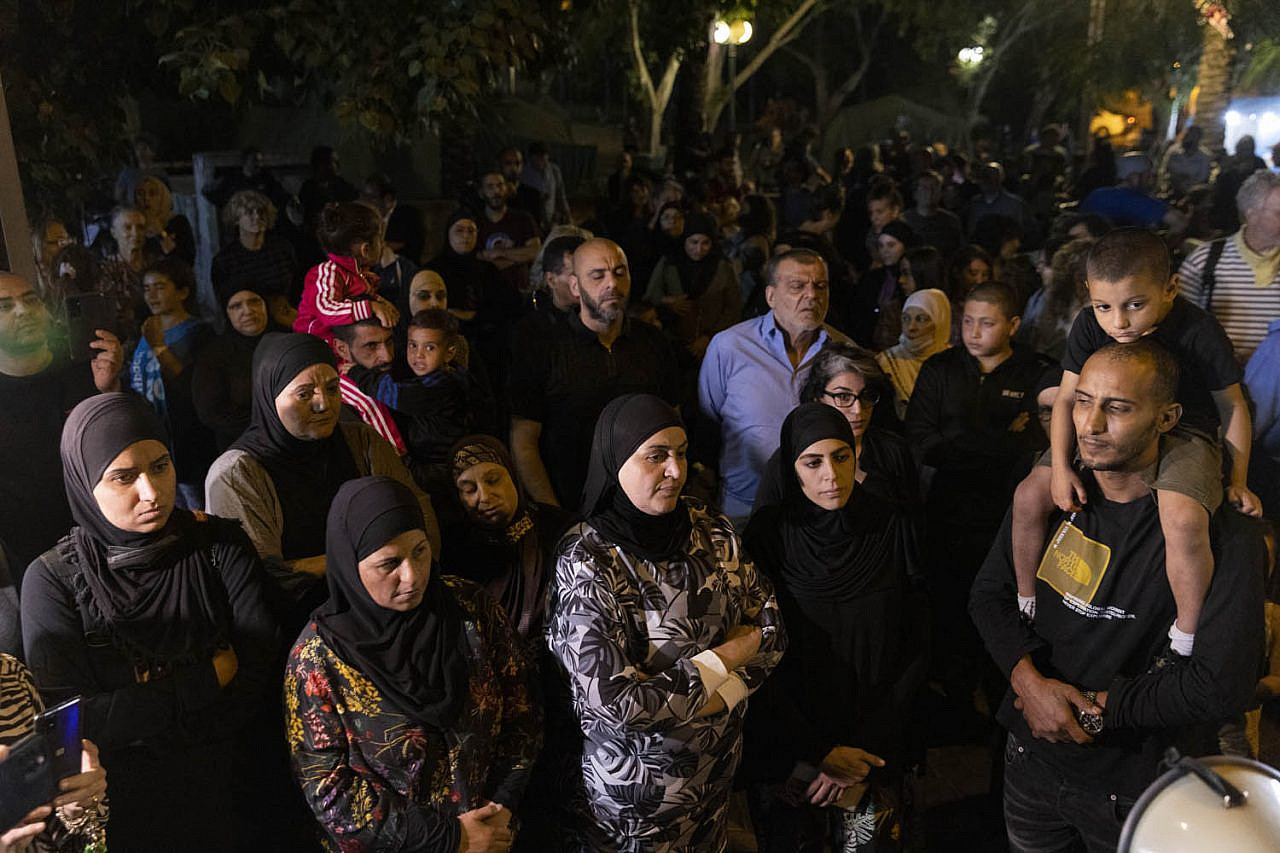 Dozens of protesters seen at a vigil in support of a group of single mothers who erected tents in protest of racialized gentrification and rising rents in the city, Jaffa, November 17, 2021. (Oren Ziv)