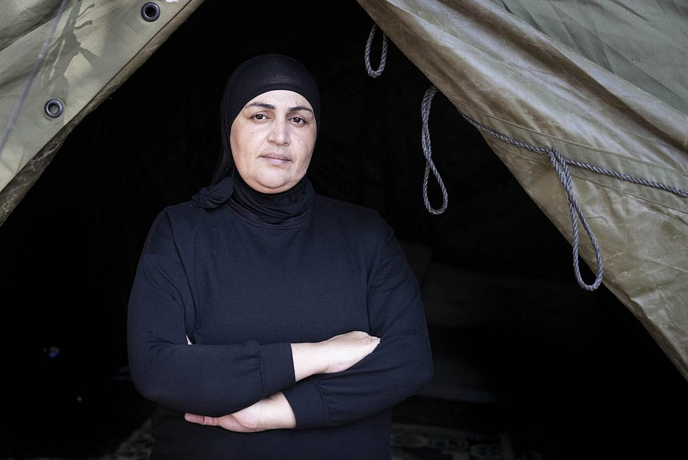 Farida Najar, a Palestinian single mother of four, seen outside her tent, which she erected in a public park in Jaffa in protest of racialized gentrification and rising rents in the city, November 17, 2021. (Oren Ziv)