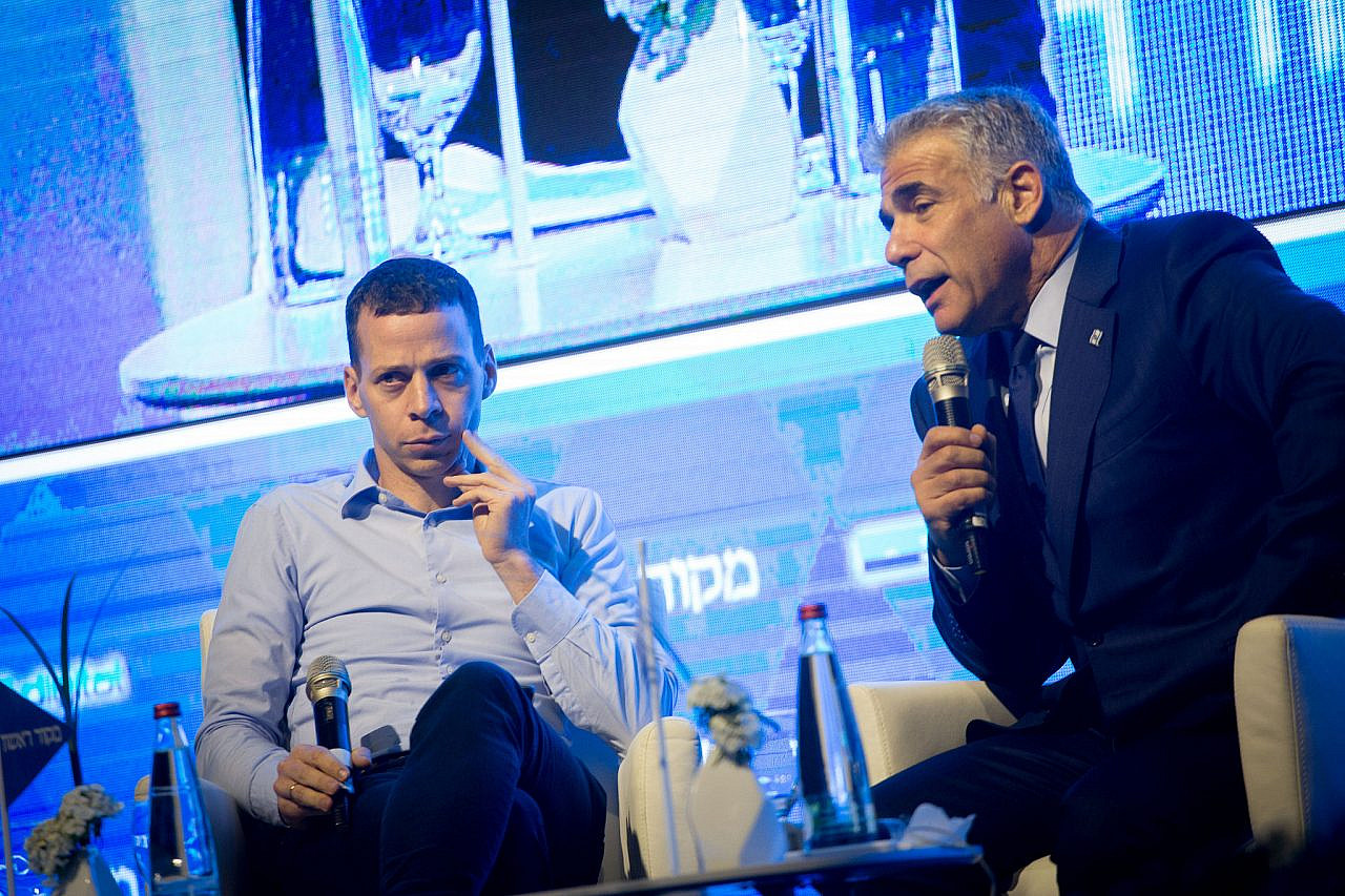 Israeli journalist Amit Segal interviews Yesh Atid head Yair Lapid at the Makor Rishon conference, Hilton Hotel, Tel Aviv, July 4, 2017. (Miriam Alster/FLASH90)