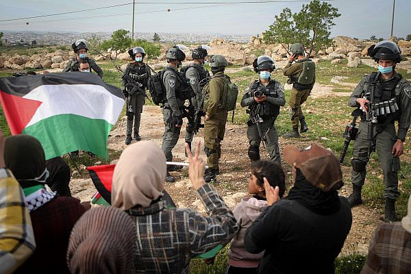 Palestinians protest the visit of Israeli Prime Minister Benjamin to the heritage site of ancient Susya, in Yatta, near the West Bank city of Hebron, March 14, 2021. (Wisam Hashlamoun/Flash90)