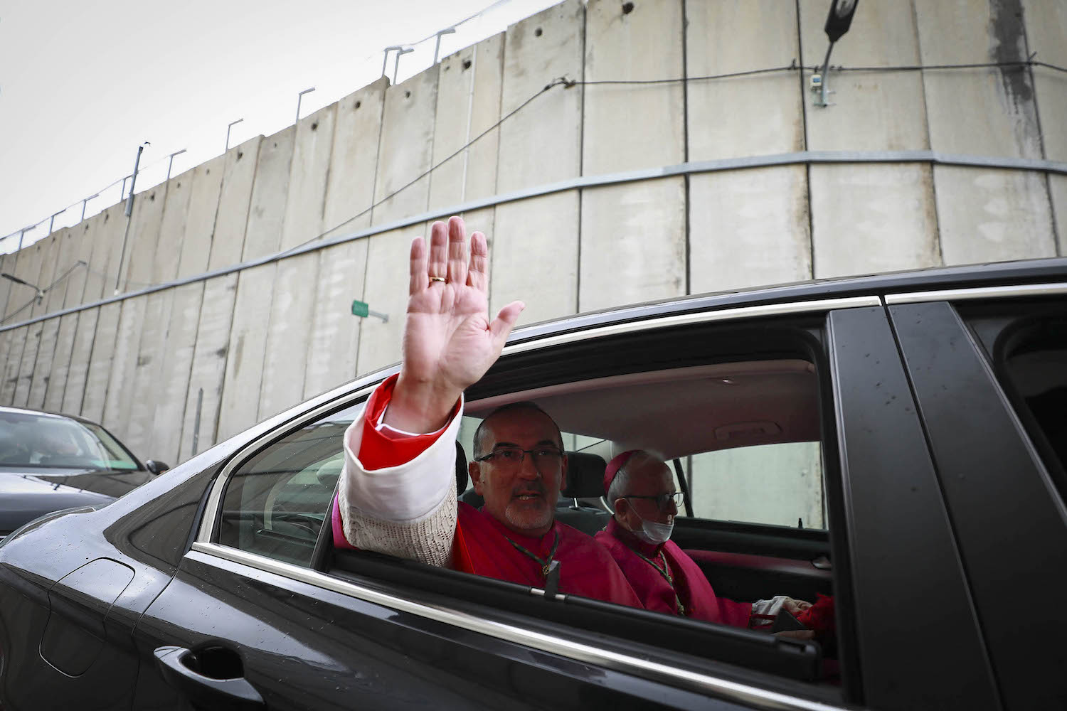 Latin Patriarch Pierbattista Pizzaballa (left) the top Catholic clergyman in Palestine, arrives at the Church of the Nativity ahead of the midnight Christmas Mass, Bethlehem, West Bank, December 24, 2021. (STR/Flash90)
