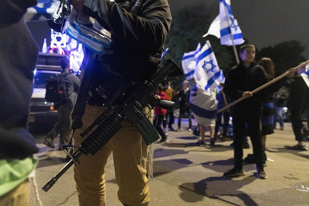 Israeli right wingers take part in the 'flag march' in the city of Lydd, December 5, 2021. (Oren Ziv)
