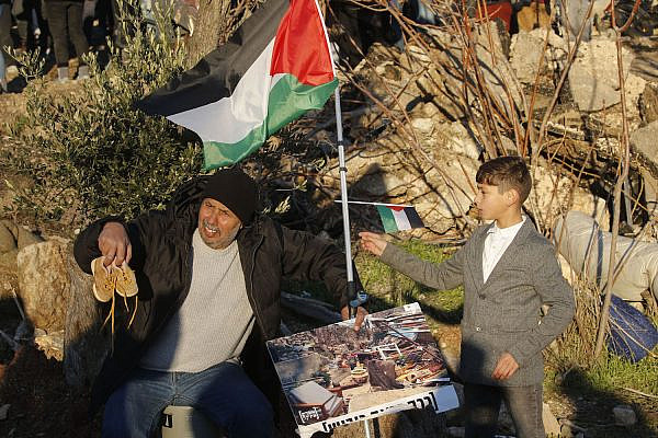 Palestinians and left-wing Israeli activists protest against the expulsion of Palestinian families from their homes in the East Jerusalem neighborhood Sheikh Jarrah, January 21, 2022. (Jamal Awad/Flash90)